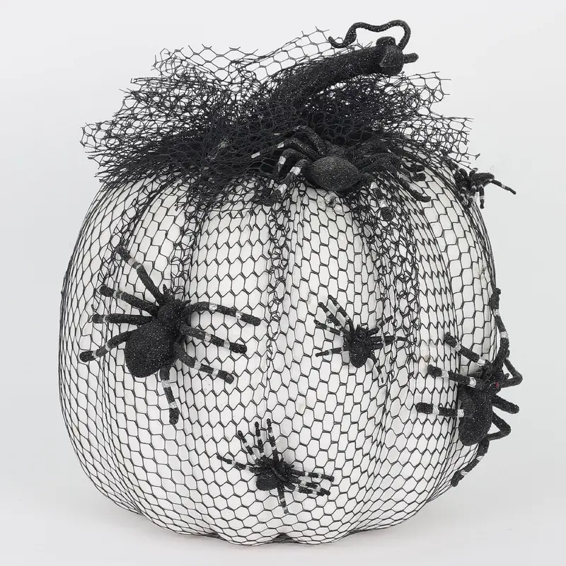 Black netted white pumpkin with spider