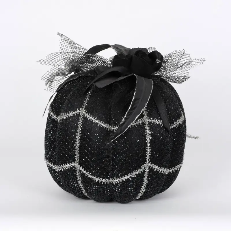 Black pumpkin with white spiders