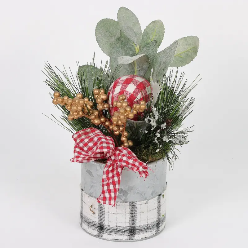 Decorative pot with golden berries and pine needles