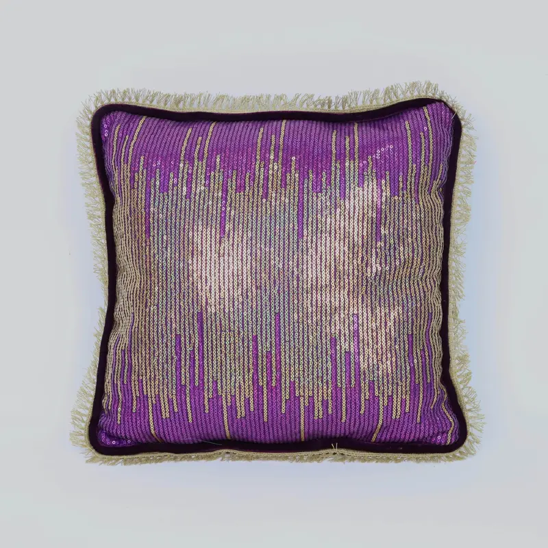 Purple and gold pillow beaded on one side with side tinsel edge