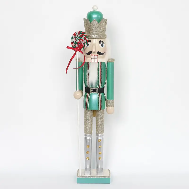 Nutcracker holding peppermint staff