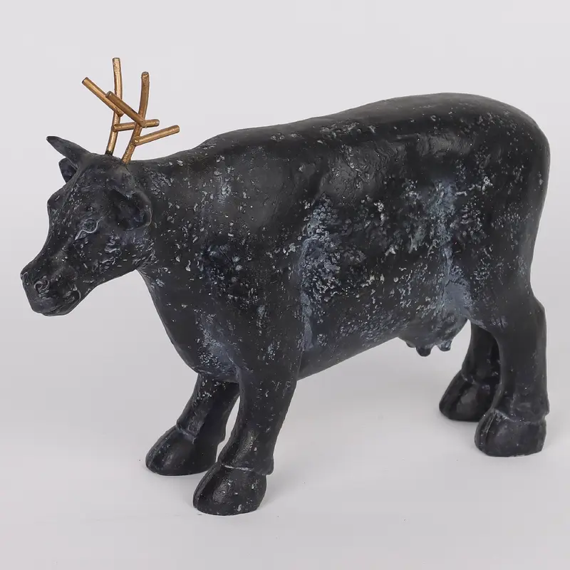 Polyresin cow with reindeer antlers