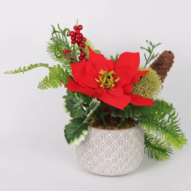 Red floral arrangements in polyresin pot