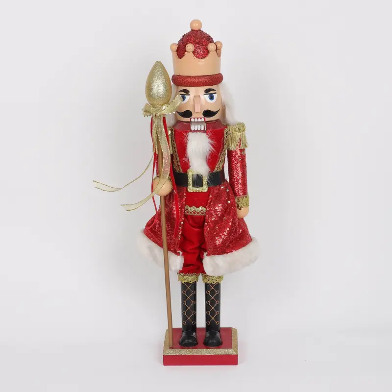 Red king nutcracker with red cape and staff