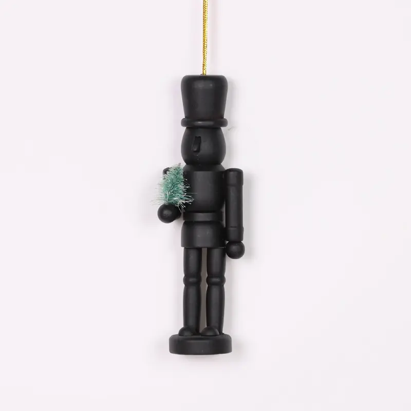 Nutcracker holding tree ornament