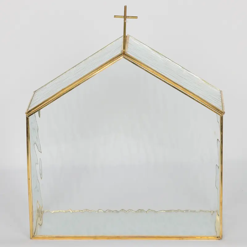 Textured glass house with cross on roof