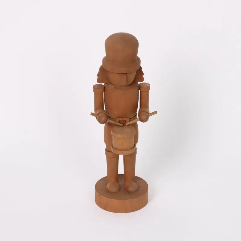 Wooden dark brown painted nutcracker with drums